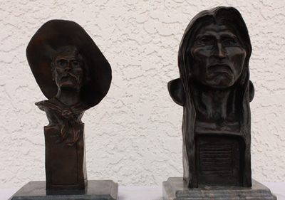 Lot of Remington bronze sculptures: Lot of Remington bronze sculptures containing Sargent bronze sculptures after Remington measuring approx. 10Hx6x6 signed with a dark brown patina the lot also contains a "Savage" bronze sculpture