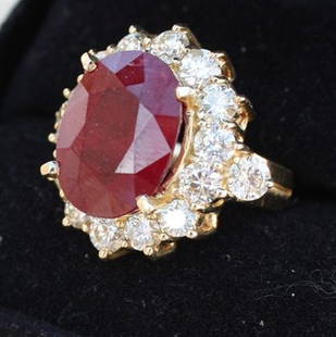 Ladies Ruby and Diamond ring: One ladies ruby and diamond ring containing in the center one faceted oval shape ruby of approx. 5.40 cts. Rated Type II and surroung faceted round full cut diamonds of approx. 1.50 cts.SI-2 to I-1