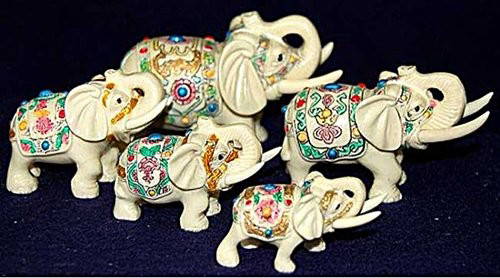 Elephant Family Herd of five statues: Hand painted Elephant herd of five sculptures measuring averaging from 4Lx2.5H to 2.25L x1h. Hand painted accents.Made from ox bone and accents. Very good condition.