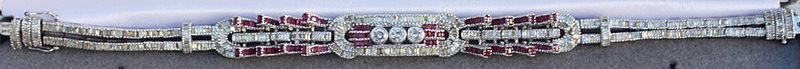 18KT Ruby and Diamond Bracelet: One ladies 18k Ruby and Diamond bracelet rubies of approx. 2.77 cts and diamonds of approx. 4.38cts rated I-1 in clarity and G-h and light yellow in color. Set in 18kt white gold. Very Low opening