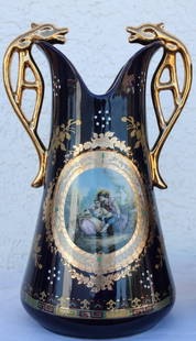 Ornate porcelain vase: Ornate porcelain vase measuring approx. 14x9x7 containing painted and gold reliefs. Very good condition.