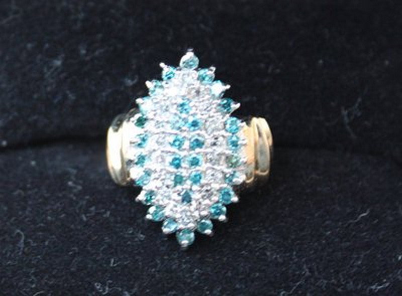 Ladies Blue and white diamond ring: Ladies Blue and white diamond ring containing 2.04cts of diamonds rated SI-2 to I2 in clarity and Blue in color and IJ in color.