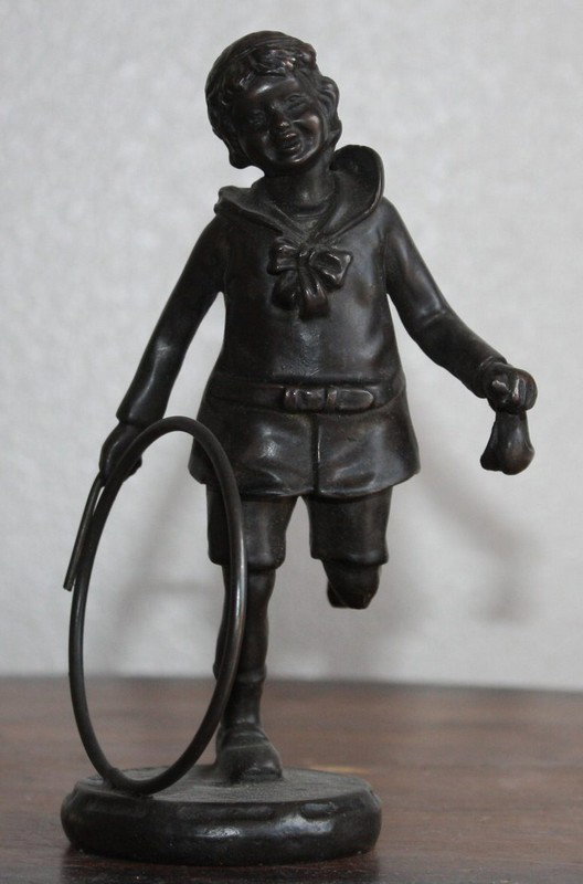Moreau "Girl with hoop" bronze sculpture: "Girl with hoop" bronze sculpture after Moreau measuring approx. 6.5h x 4w x 4d with a dark brown patina and good detail.
