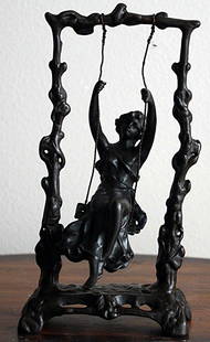 Moreau "Girl on Swing" bronze sculpture: "Girl on Swing" bronze sculpture after Moreau measuring approx. 10h x 5.5w x 6 with a dark brown patina with good detail and patina. The sculpture is in good condition.