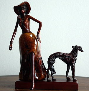 "Aristocrat Lady with Dog" sculpture: "Aristocrat Lady with Dog" sculpture measuring approx. 10.5 x 8 x 6 made of fine wood carving. The sculpture is in very good condition.