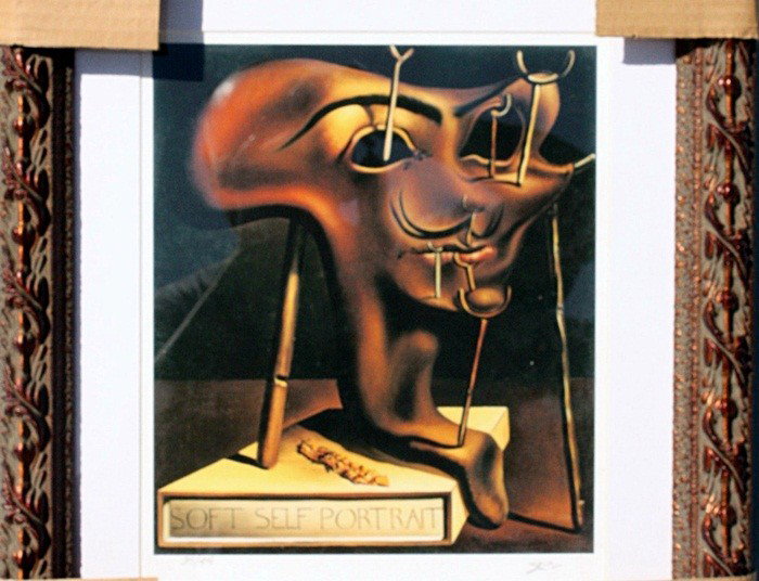Dali "Self Portait Of Fried Bacon" Lithograph Ltd: Dali "Self Portrait Of Fried Bacon".The work is a Limited Edition Giclée.Signed and Numbered in pencil.Approx. 19x17. Printed on a heavy weight high quality arches type paper. Beautifully framed and 