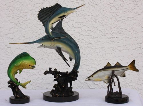Lot of Sealife bronze sculptures: lot of sealife bronze sculptures containing one Mahi fish sculpture measuring approx. 5.5hx3x3.5 containing a Swordfish duo measuring approx. 15hx11x5 and a Snnok fish bronxe sculpture measuring appro