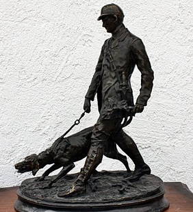 Mene "Hunter w/hound" sculpture: "Hunter w/hound" after Mene bronze sculpture measuring approx. 18hx13x7. Dark brown finish. Good condition.