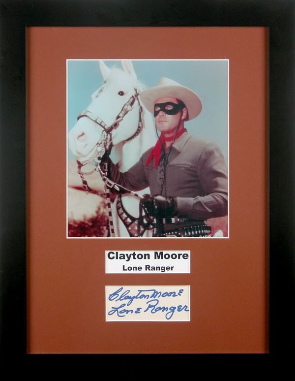 LONE RANGER CLAYTON MOORE SIGNED CARD W/PHOTO: 1233. CLAYTON MOORE (1908-1999). Tall leading man of '40s second features, later famous as television's Lone Ranger. Signed card, adding "Lone Ranger," in blue felt tip, 4"x1¾". Attractively matted b