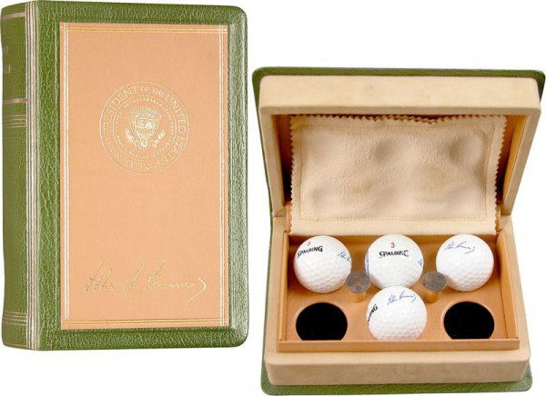 KENNEDY PRESIDENTIAL GOLF BALL GIFT SET: 472. [KENNEDY PRESIDENTIAL GOLF BALL SET] Fine set of four Spalding presidential golf balls and two greens markers with incused symbols. The golf balls each bear his facsimile signature and Presidenti