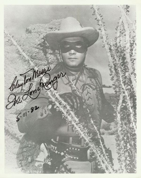 CLAYTON MOORE SIGNED PHOTOGRAPH: 1026. CLAYTON MOORE (1908-1999). Tall leading man of '40s second features, later famous as television's Lone Ranger. Printed SP, b/w, 8"x10" three-quarter length film still. Darkly signed in black fel