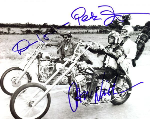 EASY RIDER CAST SIGNED PHOTOGRAPH: 740. [EASY RIDER] Academy Award nominated 1969 film that achieved much notoriety and gave impetus to low-budget films. SP, b/w, 10"x8" film still of a scene with stars