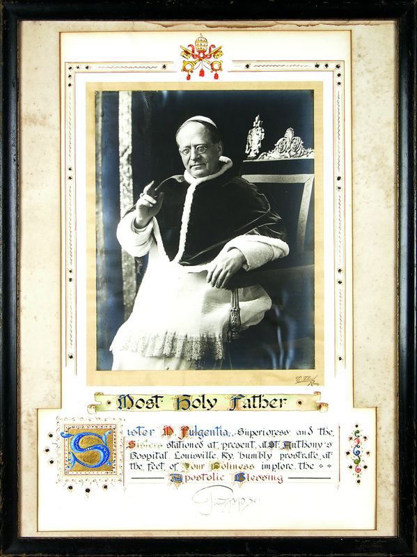 PIUS XI PHOTOGRAPH AND SIGNATURE/ILLUMINED TEXT: 35. PIUS XI Ambrogio Damiano Achille Ratti (1857-1939). Pope (1922-1939) who signed Lateran Treaty with Benito Mussolini granting papal sovereignty over Vatican City and struggled with Nazi Germany re