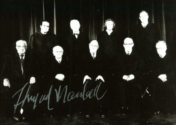 THURGOOD MARSHALL SIGNED SUPREME COURT PHOTOGRAPH: 370. THURGOOD MARSHALL SP, b/w, 5"x3½" portrait of the Rehnquist Court. Darkly signed in silver ink near his image. Photographic image slightly dark; bold signature only slightly uneven; else VG. Est