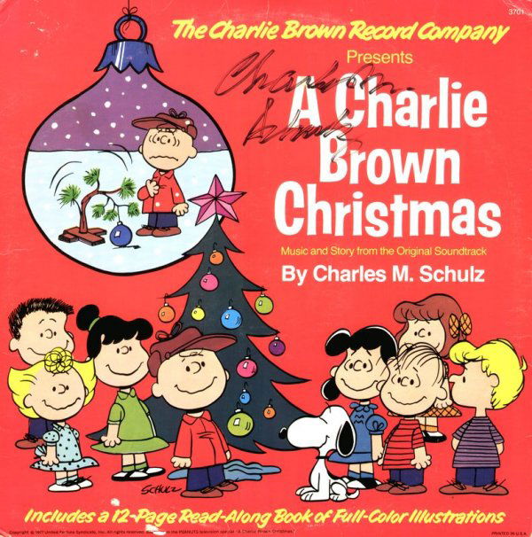 CHARLES M. SCHULZ SIGNED PEANUTS CHRISTMAS ALBUM: 745. CHARLES M. SCHULZ Colorful record album cover for 1977 United Feature release from Peanuts television special A Charlie Brown Christmas containing color illustrated 12pp "Read-Along Book" within.