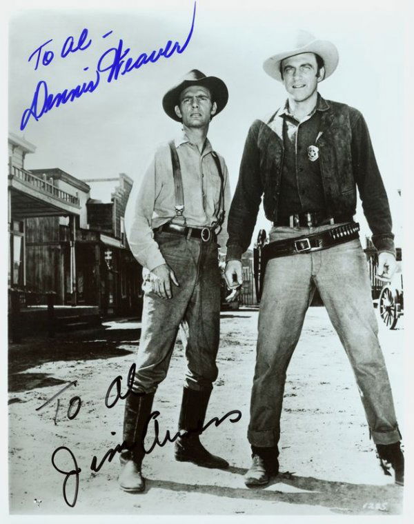 JIM ARNESS & DENNIS WEAVER SIGNED GUNSMOKE PHOTO: 956. [GUNSMOKE] Until 2005, the Western series was the longest running prime time series with recurring characters (1955-75). It starred JAMES ARNESS (b. 1923) as Marshal Matt Dillon;