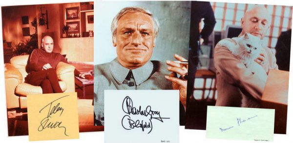 3 JAMES BOND VILLAINS SIGNED CARDS W/PHOTOS: 970. [JAMES BOND VILLAINS] Three talented character actors, each of whom appeared as Bond's nemesis Ernst Stavro Blofeld, head of SPECTRE in each film, known as the Blofeld Trilogy. Each is accompanie