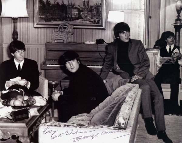 GEORGE MARTIN SIGNED EARLY BEATLES PHOTOGRAPH: 1055. [THE BEATLES] Legendary British rock group from Liverpool (1960-70) responsible for the "British Invasion" of the '60s. SP, b/w, 10"x8" casual seated portrait of the young band members, Paul, Jo