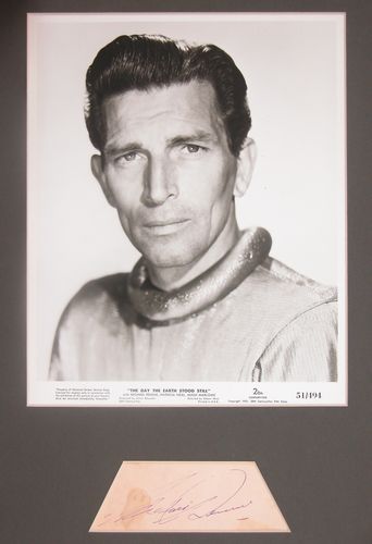 MICHAEL RENNIE: 937. MICHAEL RENNIE (1909-1971). British leading man best known as television's The Third Man, in films since 1936. Boldly penned signature in violet ink on pink album leaf, 5"x2". First initial penne