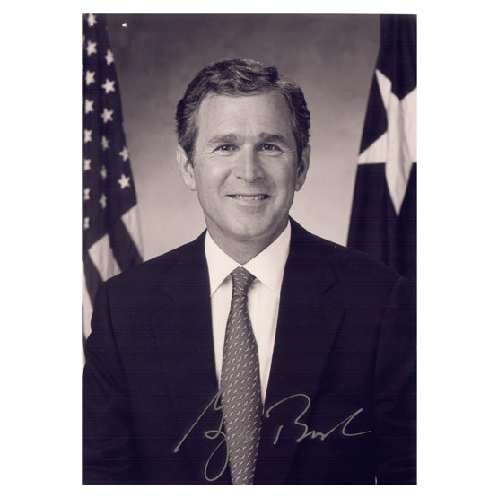 GEORGE W. BUSH: Two signed index cards, 5"x3", boldly penned in felt tip. Accompanied by a b/w 5"x7" half-length portrait with facsimile signature. Fine.