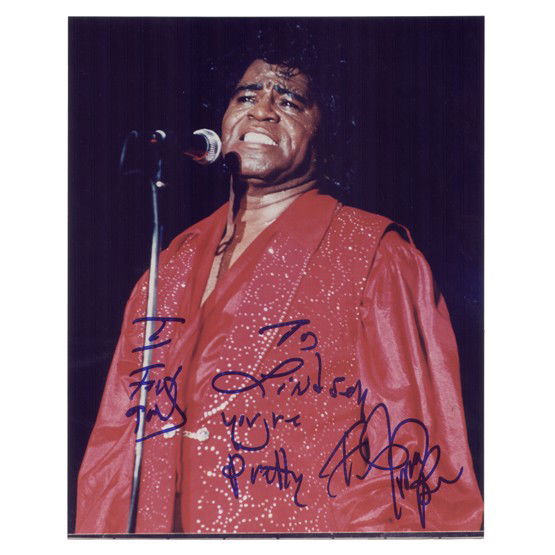 JAMES BROWN: (1933-2006). Influential American singer and entertainer renowned as "The Godfather of Soul." ISP, color, 8"x10" half-length image in concert. Boldly signed in blue felt tip. VG.