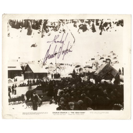 CHARLIE CHAPLIN: (1889-1977). English film actor, director, producer and composer famed for his childlike "tramp" character in silent films. He was knighted in 1975. SP, B/W, 10"x8" film still in a scene from a United