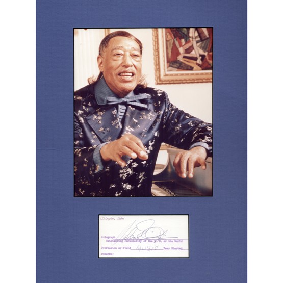 DUKE ELLINGTON: (1899-1974). Popular American band leader, pianist and jazz composer of such hits as "Mood Indigo," "Ko Ko" and "Sophisticated Lady." Signed printed collector's Autograph card, 4¾"x2¼". Darkly penne