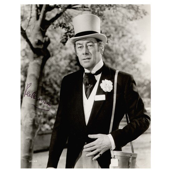 SIR REX HARRISON: (1908-1990). Academy Award and Tony winning English stage and screen actor since 1924. SP, b/w, 8"x10" promotional film still in a scene from The Yellow Rolls-Royce. Boldly signed in felt tip. Border 