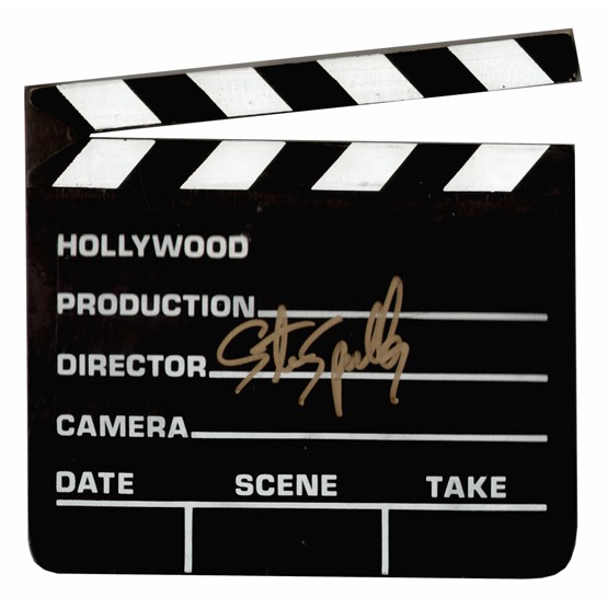 STEVEN SPIELBERG: (b. 1946). Tremendously successful American film director whose work includes blockbuster films Raiders of the Lost Ark (1981) and E.T. (1982). Souvenir replica of director's clapboard film slate, b/w