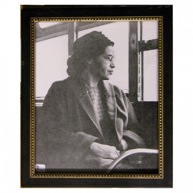 ROSA PARKS: SP, b/w, 8"x10" famed portrait of Parks seated on an Alabama bus. Signed in black felt tip across her image. Photo grainy; else near Fine. Contained within wood frame. Overall 9¼"x11¼".