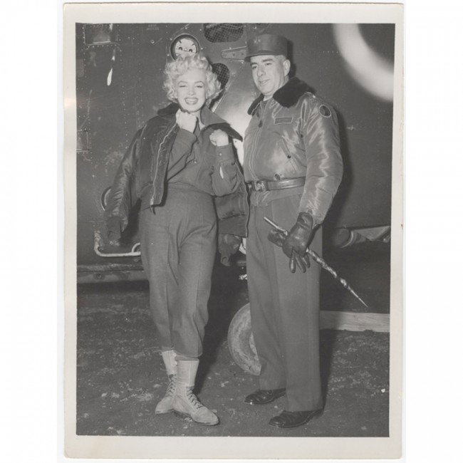 [MARILYN MONROE]: Origina,l probably unpublished, photograph, b/w, 3¾”x5” candid portrait of Marilyn in Korea standing with 7th Infantry Division Commander Major General Lionel Charles McGarr the day she performed