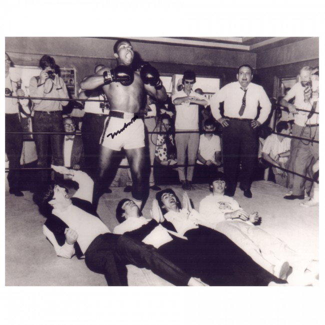 MUHAMMAD ALI: Cassius Clay (b.1942). An Olympic Gold Medal winner (1960), this boxing legend was the first boxer to win the world heavyweight title three times. SP, b/w, 10"x8" image of his famed humorous photo wit
