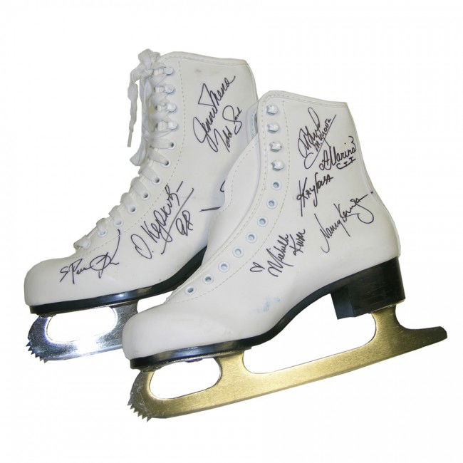 [ICE SKATING NOTABLES]: Two pairs of ice skates signed by 29 Olympic and World Figure Skating champions and notables. White Canadian SLM size 5 ice skates boldly signed by Michelle Kwan; Nancy Kerrigan; Tara Lipinski; Nicole