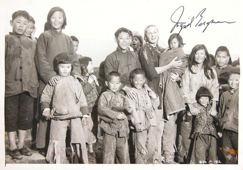 INGRID BERGMAN: 621. INGRID BERGMAN (1915-1982). Swedish stage and screen actress; three-time Academy Award winner. SP, b/w, 10"x8" film still in a scene from The Inn of the Sixth Happiness (1958). Boldly signed abov