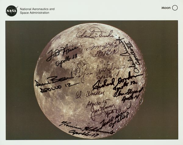 SIGNED LUNAR PHOTO 12 ASTRONAUTS (6 MOONWALKERS): 550. [ASTRONAUT COLLECTION] Splendid NASA color lithograph, 10"x8" portrait of the moon taken in Dec 1972 by the Apollo 17 mission. Darkly signed by 12 of the 24 men who flew there, six of whom are "m
