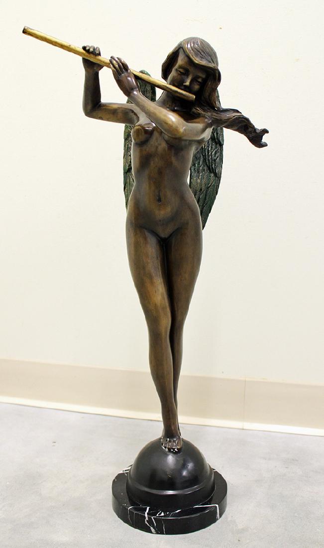 CAST BRONZE FLOUTIST: Bronze angel playing flute sculpture on a marble base. 26" tall.