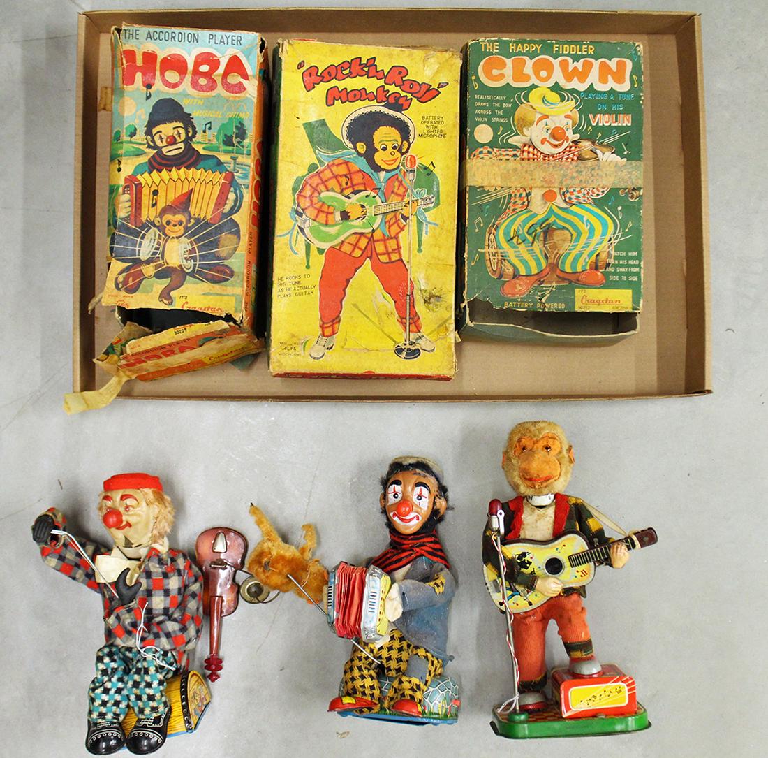 VINTAGE TIN LITHO TOYS - CRAGSTAN & ALPS: Includes battery operated Cragstan Hobo Accordion, a Cragstan The Happy Fiddler Clown Violin Player and an Alps Rock N Roll Monkey. All include the original boxes.