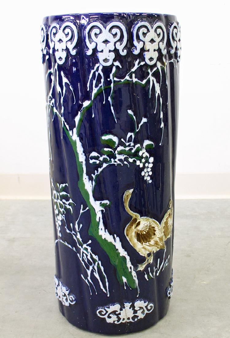 POTTERY UMBRELLA STAND: Blue Majolica umbrella stand with birds. 24" tall.