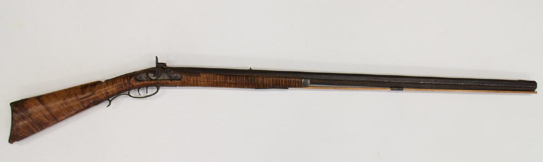 G. GOULCHER PERCUSSION HALF STOCK LONG RIFLE: Percussion half stock .38 caliber curly maple stock. Double set of triggers with a crude pewter nose cap. Lock is marked G. Goulcher and N.B. is stamped on top of barrel. 56" long. PURCHASE OF FIREARM