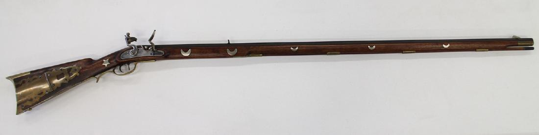 CUSTOM DAVY CROCKETT OLD BETSY FLINTLOCK LONG GUN: Davy Crockett flintlock .40 cal, walnut full stock, double set triggers, brass furniture, German silver inlays with half moons & stars, overall length 62". This gun is an exact copy of rifle presented