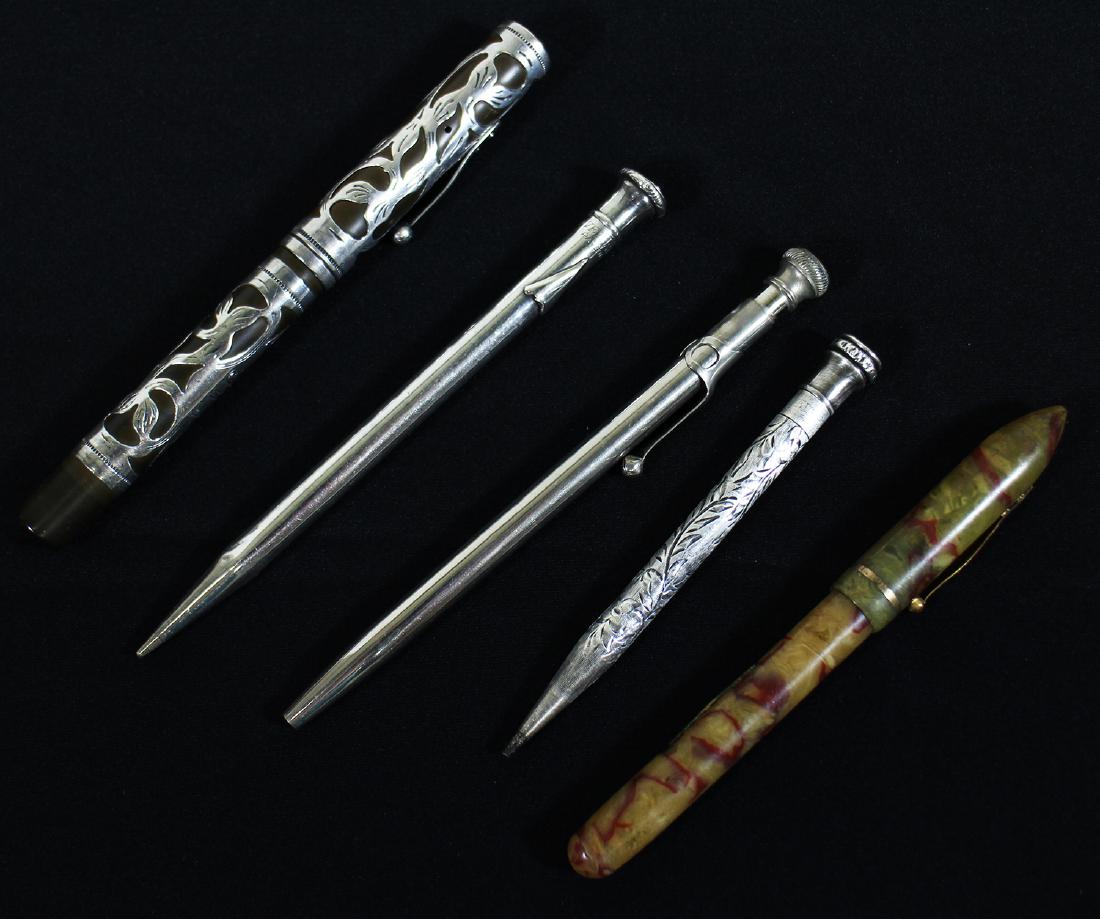 ANTIQUE STERLING FOUNTAIN PENS & PENCILS & MORE: Collection of antique fountain pens to include a Waterman's Ideal sterling filigree pen, a marbleized fountain pen, an Eversharp sterling pencil, a Wahl Eversahrp floral engraved sterling pencil and a