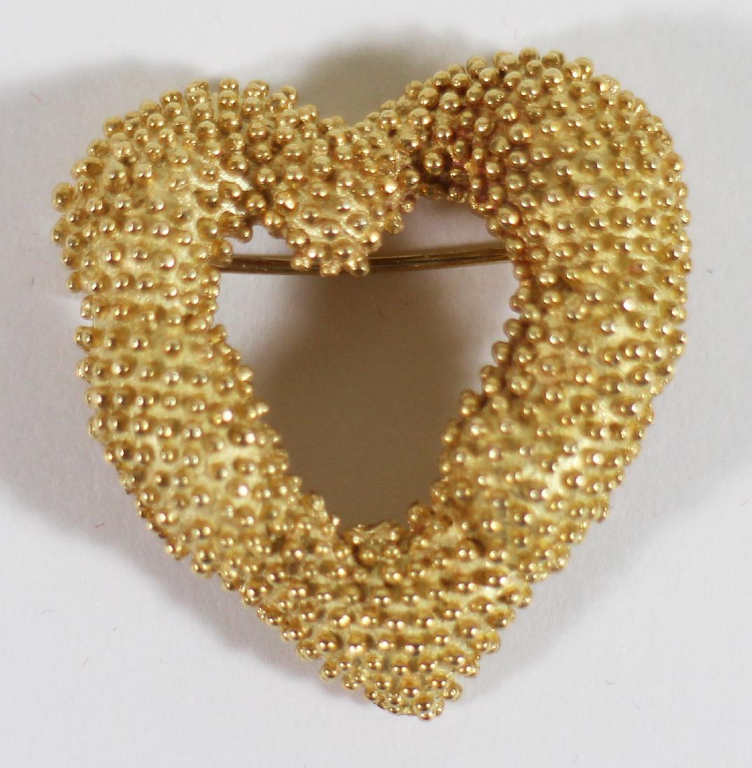 18K YELLOW GOLD HEART BROOCH: 18K yellow gold heart pendant. It measures 1 1/4" x 1 1/8". Weighs 8.2 DWT.