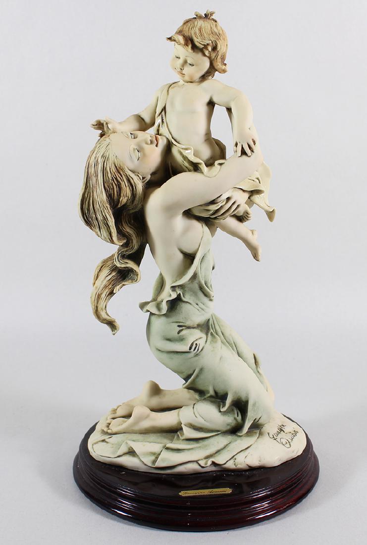 GIUSEPPE ARMANI KNELT MATERNITY FIGURINE: Giuseppe Armani mother and child Knelt Maternity figurine # 185. Includes original box. Measures 12.5" tall.