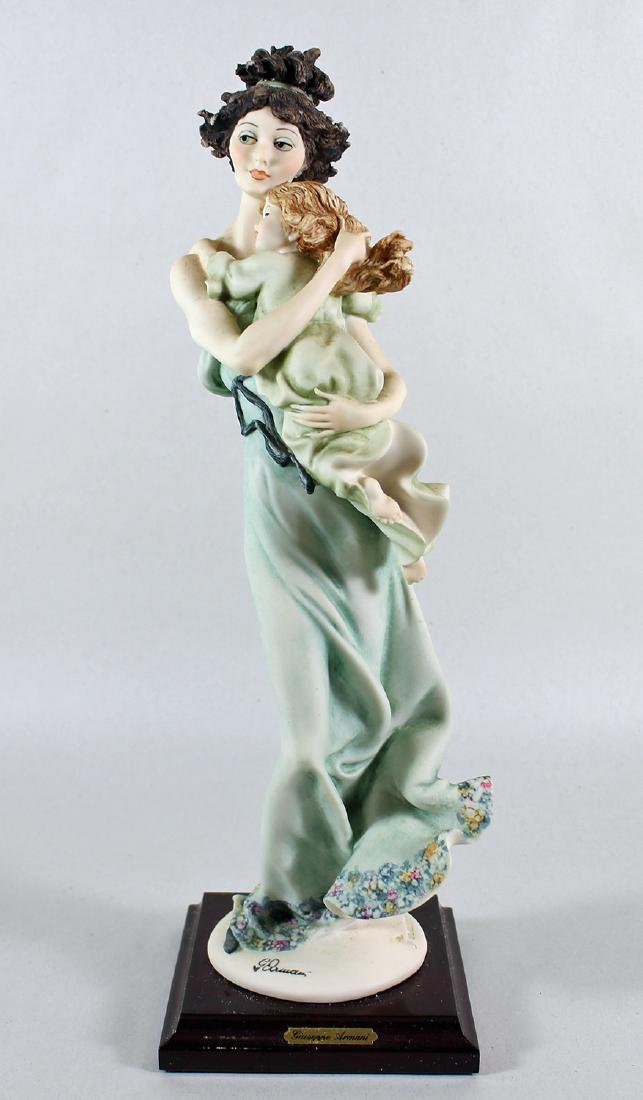 GIUSEPPE ARMANI MOTHER WITH BABY FIGURINE: Giuseppe Armani Mother and Child figurine # 754C 754 C. Measures 14.5" tall. Includes original box.