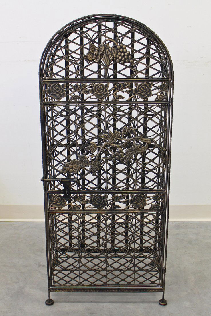 METAL WINE RACK: Metal wine rack with flower and grape design. Measures 44" tall 18" x 13" wide.