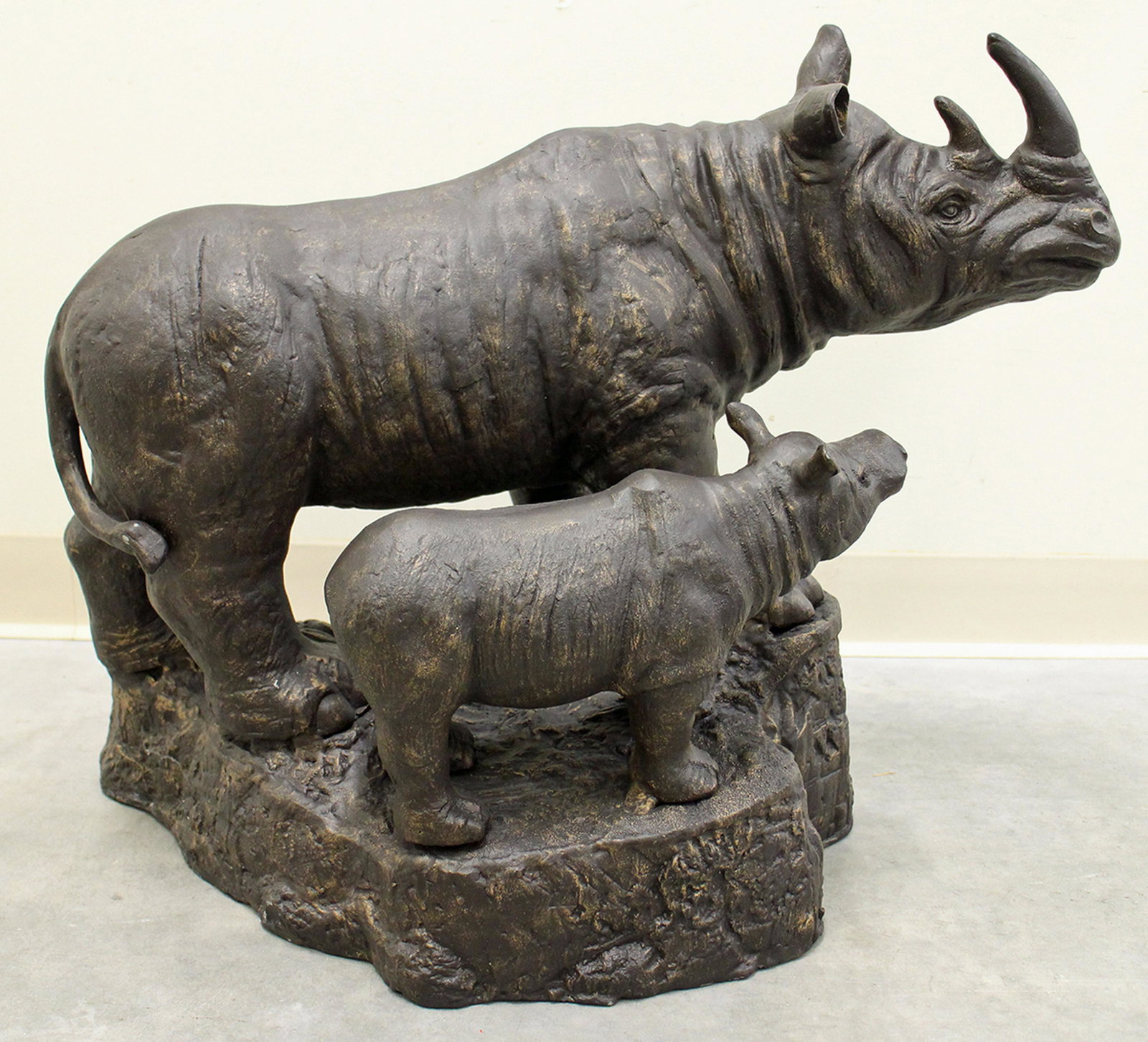 LARGE METAL RHINO SCULPTURE: Large cast metal mother & baby rhino sculpture. Measures approximately 25" wide 21" tall.