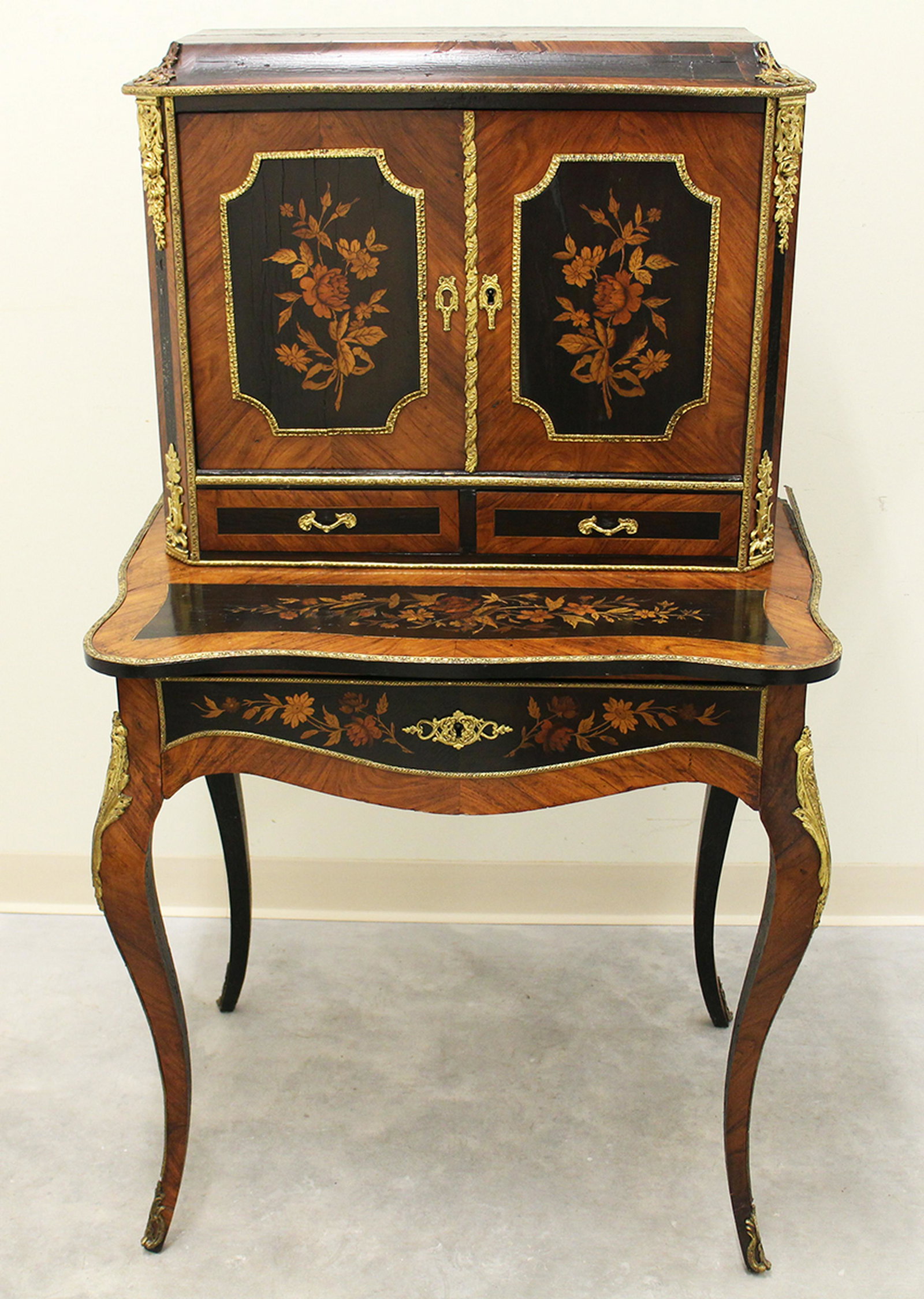 19TH CENTURY FRENCH BONHEUR DU JOUR DESK: Inlaid wood marquetry French Bonheur Du Jour desk cabinet with ormolu accents. Measures 51" tall 29" x 18.5" wide.