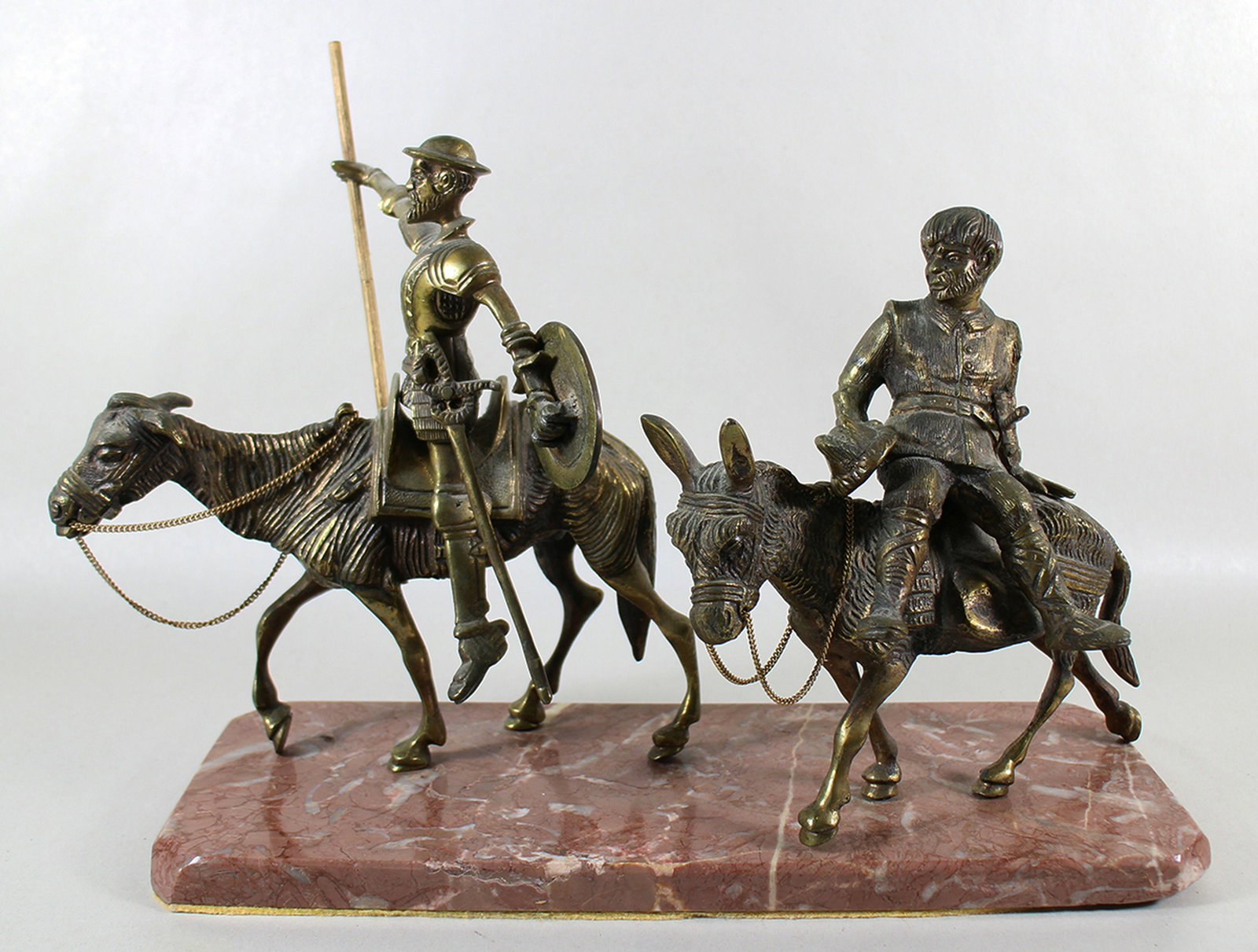 DON QUIXOTE AND SANCHO PANZA SCULPTURE: Bronze cast metal sculpture of Don Quixote & his sidekick Sancho Panza. On a marble base. Measures 18" x 11" x 6"