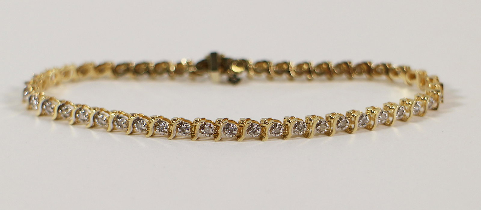 14K DIAMOND TENNIS BRACELET: 14KT yellow gold diamond tennis bracelet with (47) round diamonds (I-J color I clarity). Weighs 7.8 grams, measures 7" long.