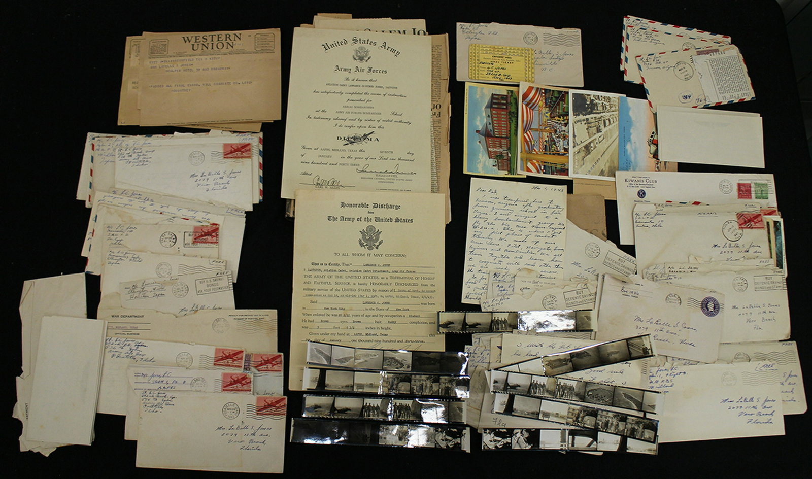 WWII LETTERS FROM LAWRENCE COURTNEY JONES: Collection of WWII letters, photographs, & more. Collection of is from Lawrence Courtney Jones whose plane was shot down over the Adriatic Sea in 1943 and was pronounced dead after M.I.A.
